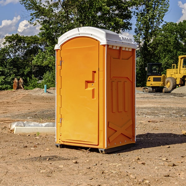 what is the cost difference between standard and deluxe portable restroom rentals in Tyrone